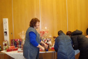 Jill Brudney sticking winner numbers to the prizes